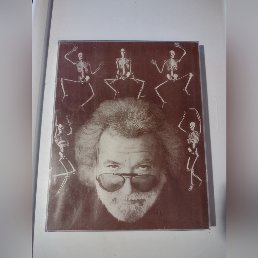Jerry Garcia with dancing skeletons picture in plastic frame